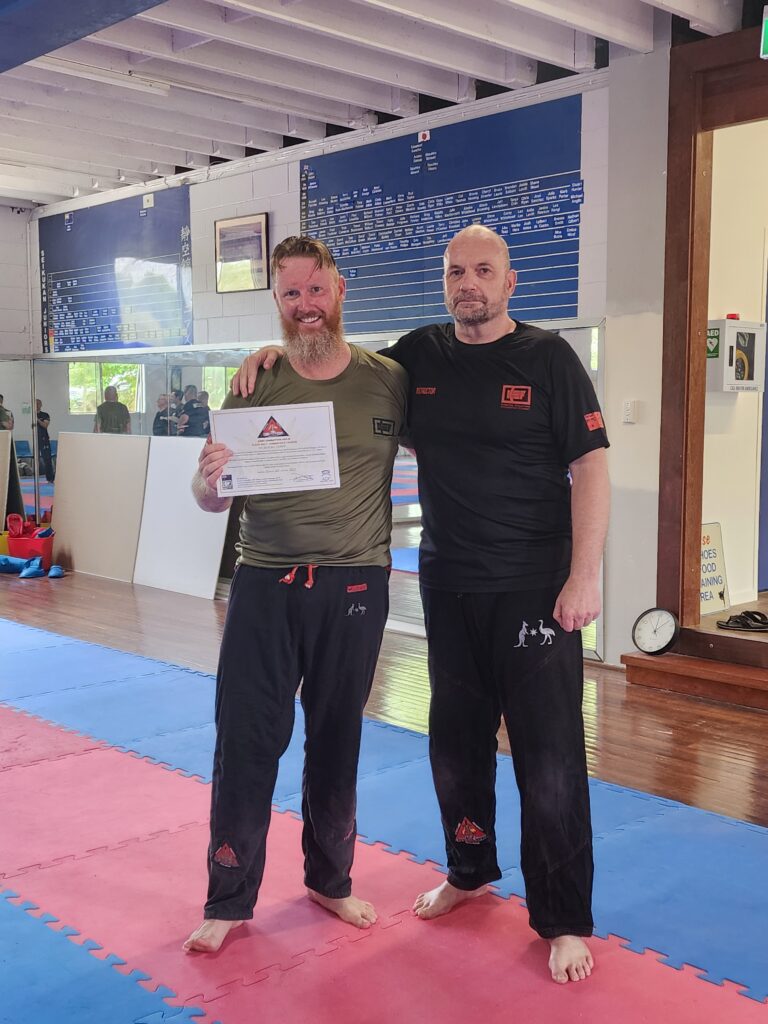 Lachlan and KEF Instructor Being Presented With Certificate