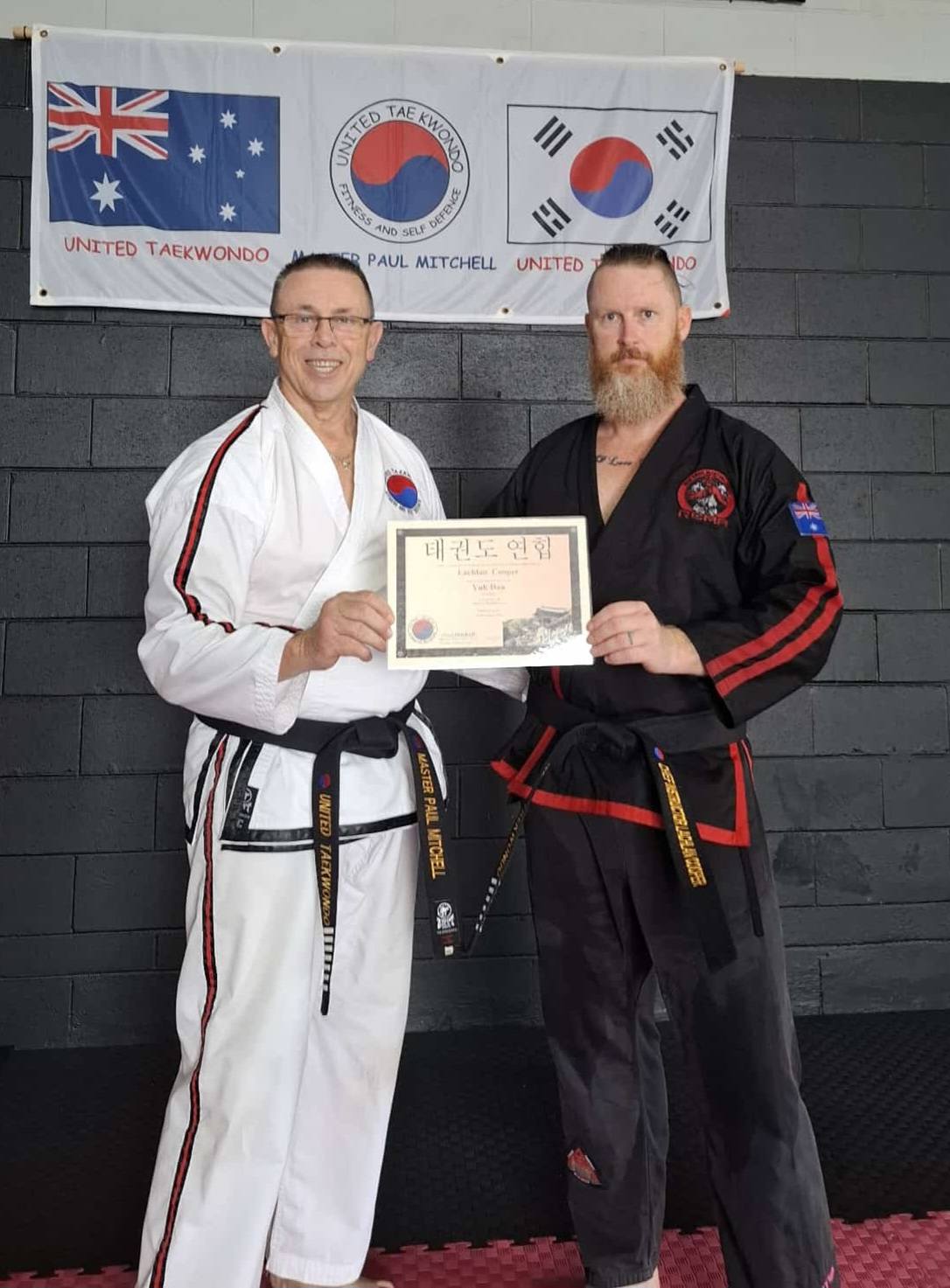 Portrait of Chief Instructor Lachlan Cooper and Master Paul Mitchell